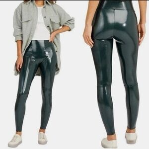 Spanx faux patent leather leggings in deep green color size M